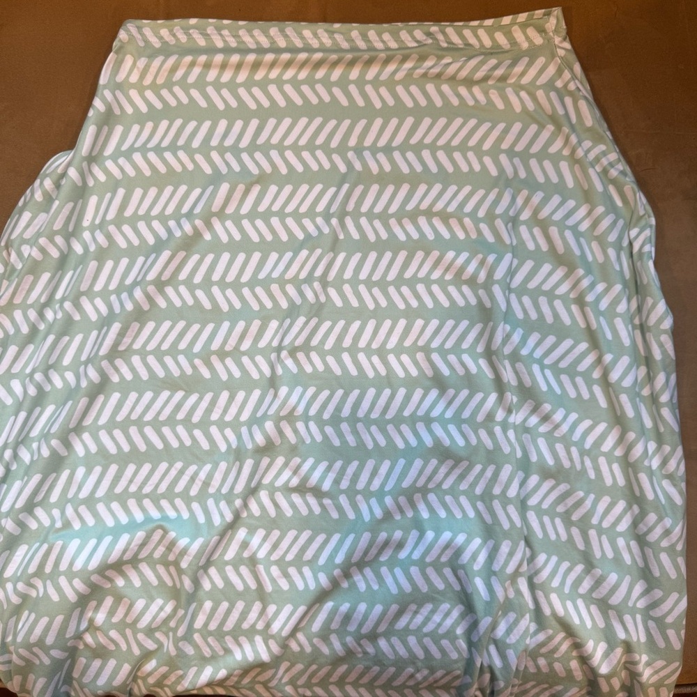 Green and white Simka rose multi use car seat and feeding cover